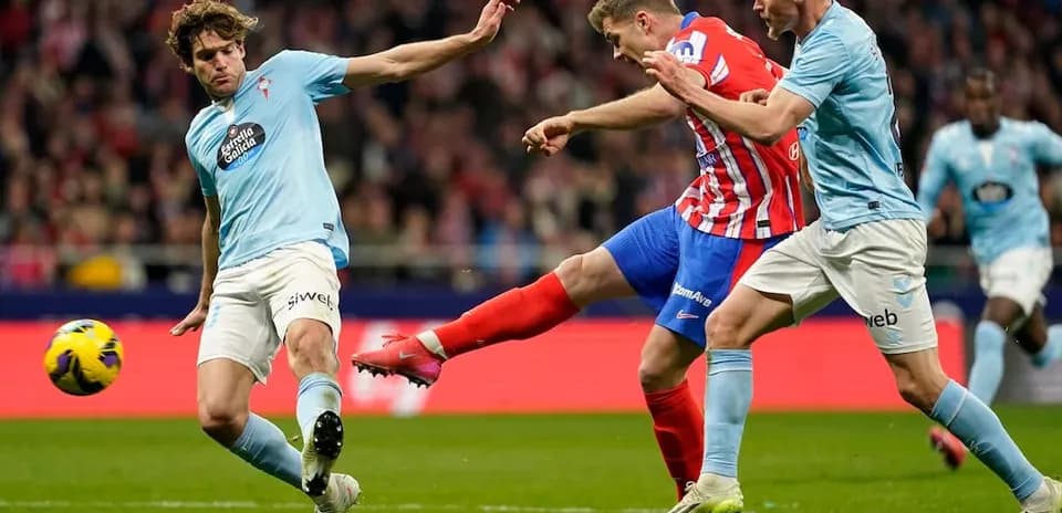 Atletico Madrid player striking the ball against Celta Vigo