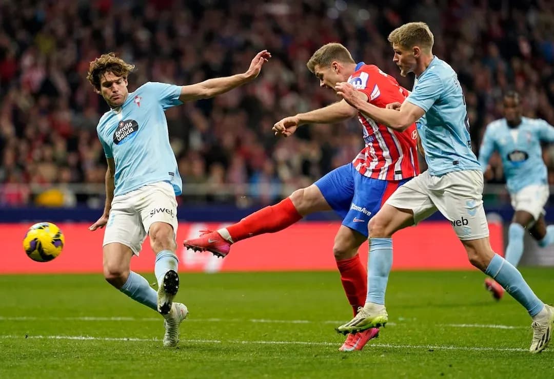 Atletico Madrid player striking the ball against Celta Vigo