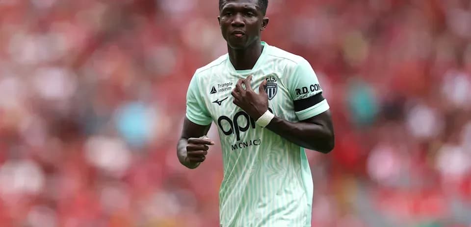 Player wearing Monaco kit during match action
