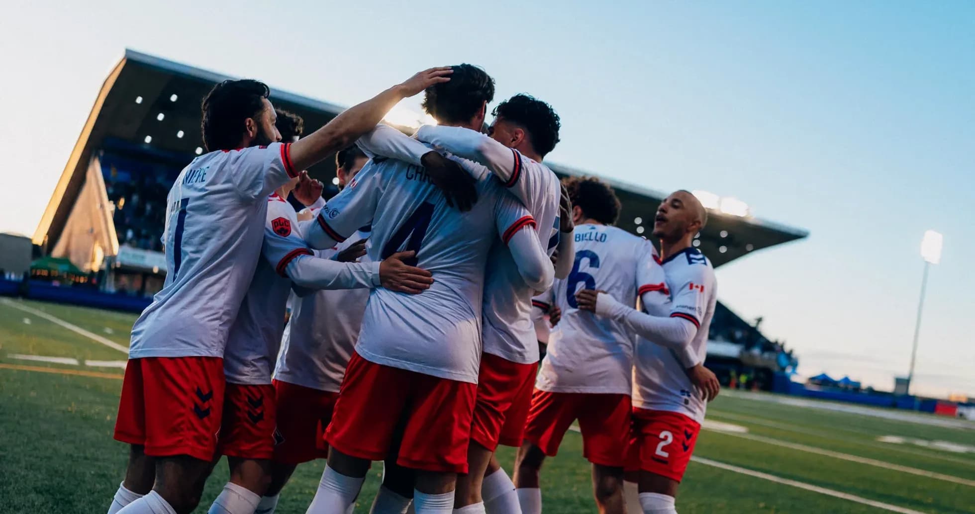 Players celebrating a goal during match