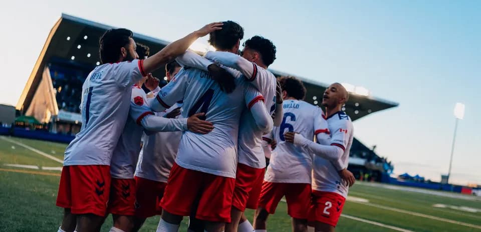 Players celebrating a goal during match