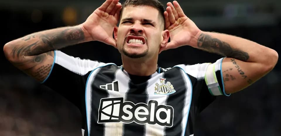 Player celebrating with hands to ears during match