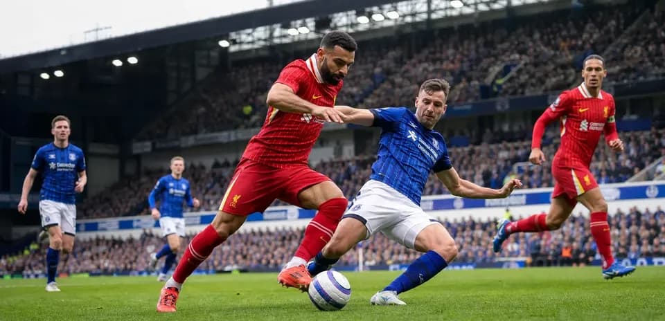Players contesting the ball during Liverpool vs Everton match