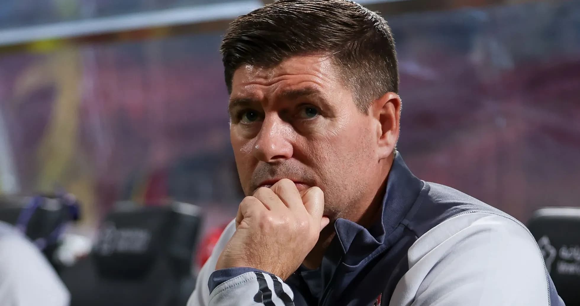 Coach observing from the sidelines during a match