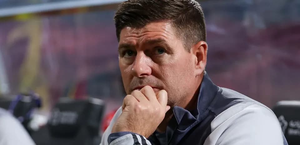 Coach observing from the sidelines during a match