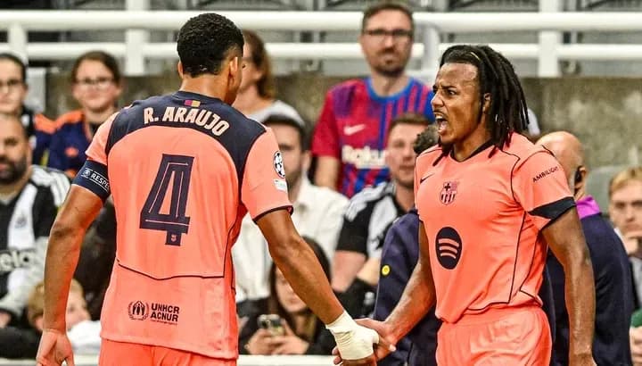 Two players celebrating during a UEFA Champions League match