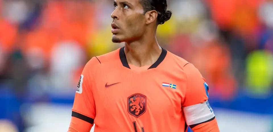 Player in orange jersey looking up on field