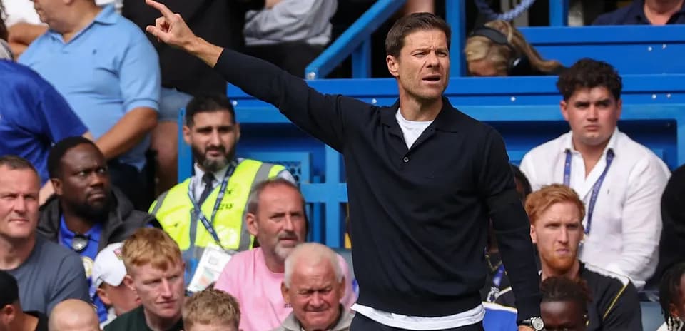 Coach gesturing from the sidelines during match