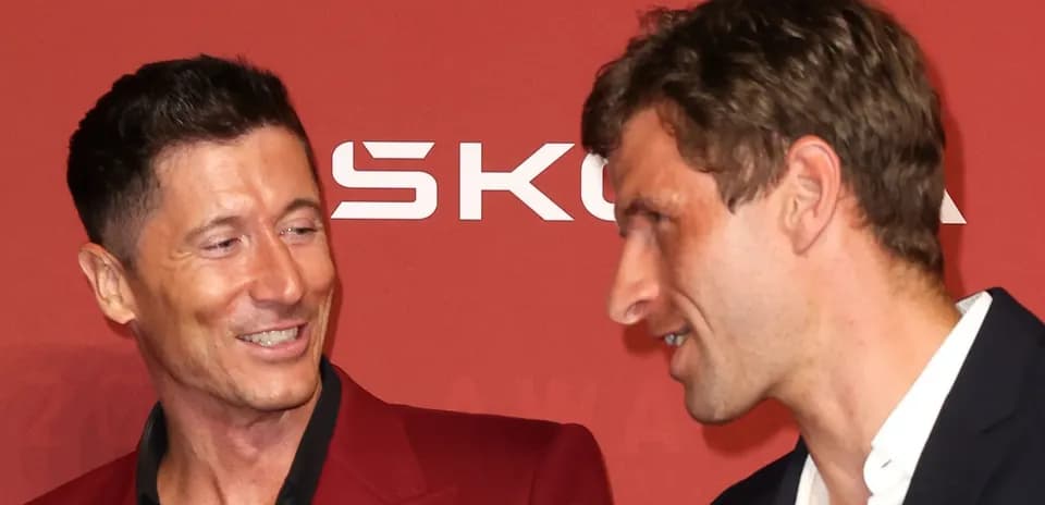 Two men in conversation at an award event