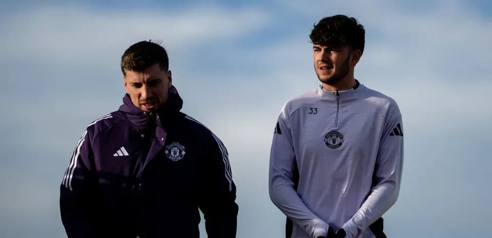 Two Manchester United players walking on training ground