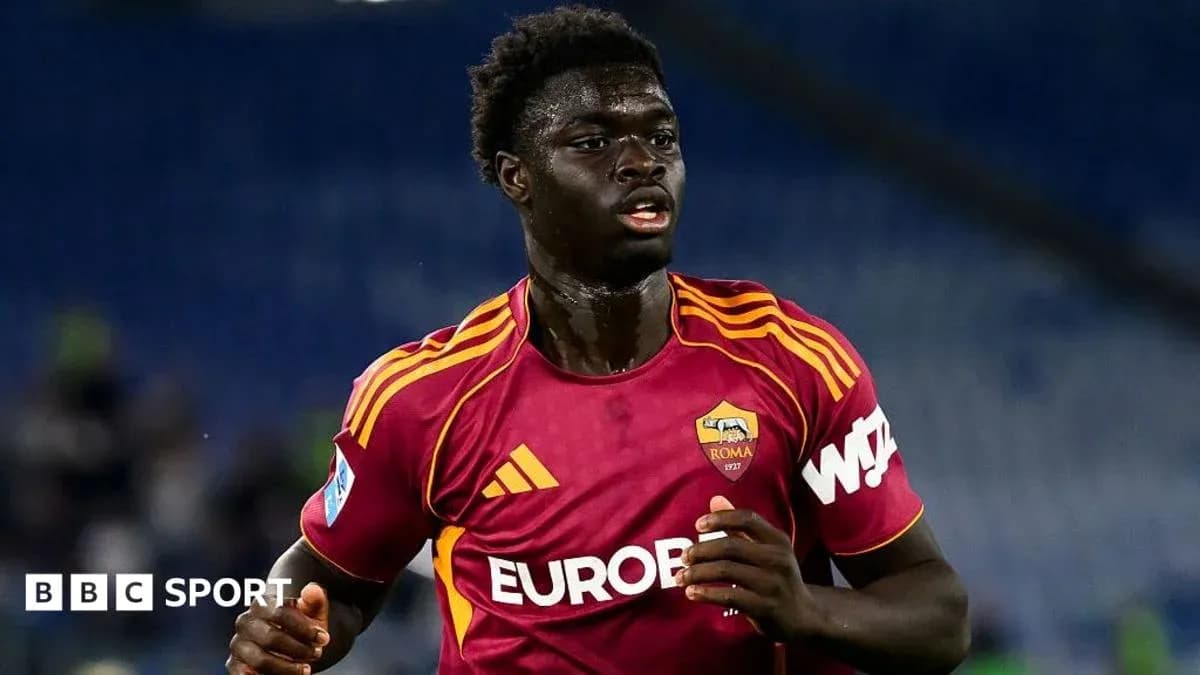 Player in AS Roma kit running on the pitch