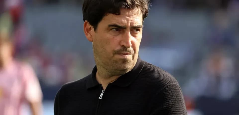 Coach observing the match from the sidelines
