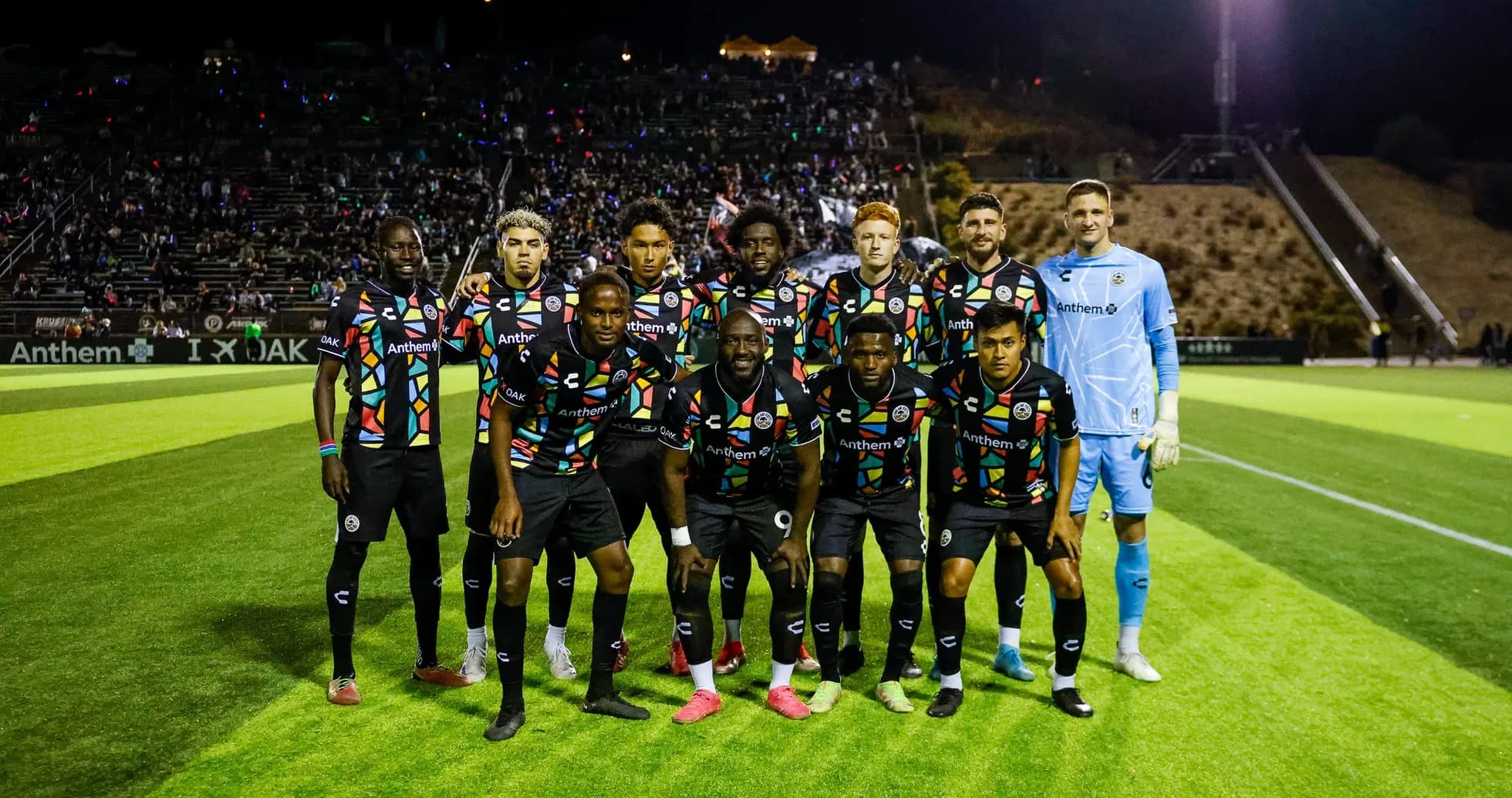 Oakland Roots team posing for photo before match