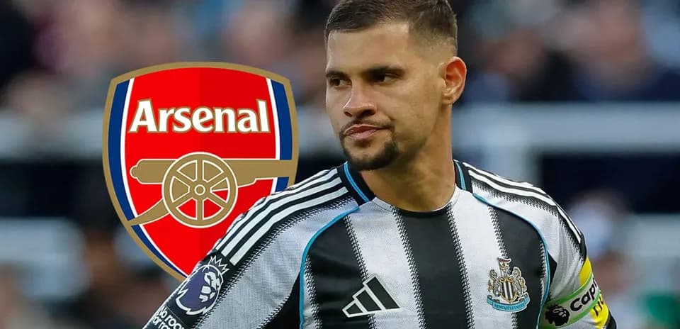 Newcastle player with Arsenal logo in background