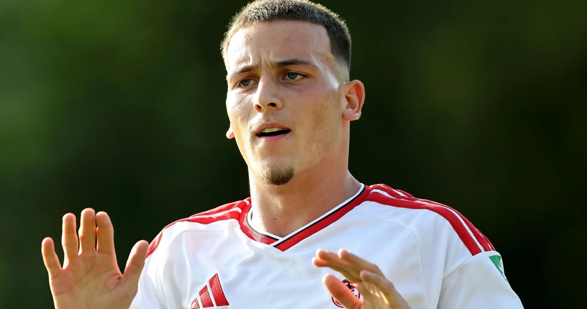 Player gesturing during training session outdoors