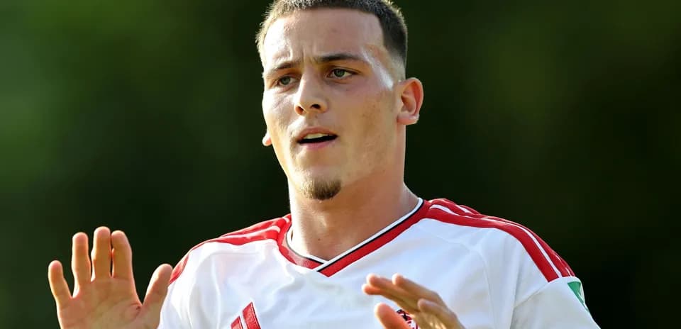 Player gesturing during training session outdoors