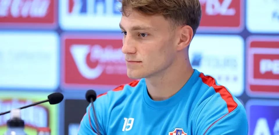 Player in Croatia jersey at press conference