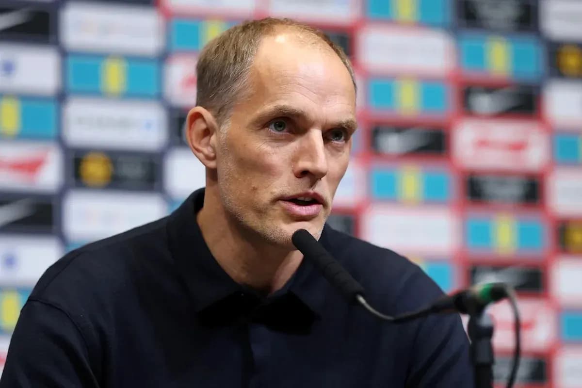 Manager speaking at press conference with microphone