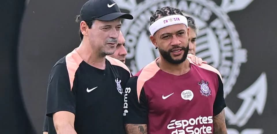Coach and player talking during training session