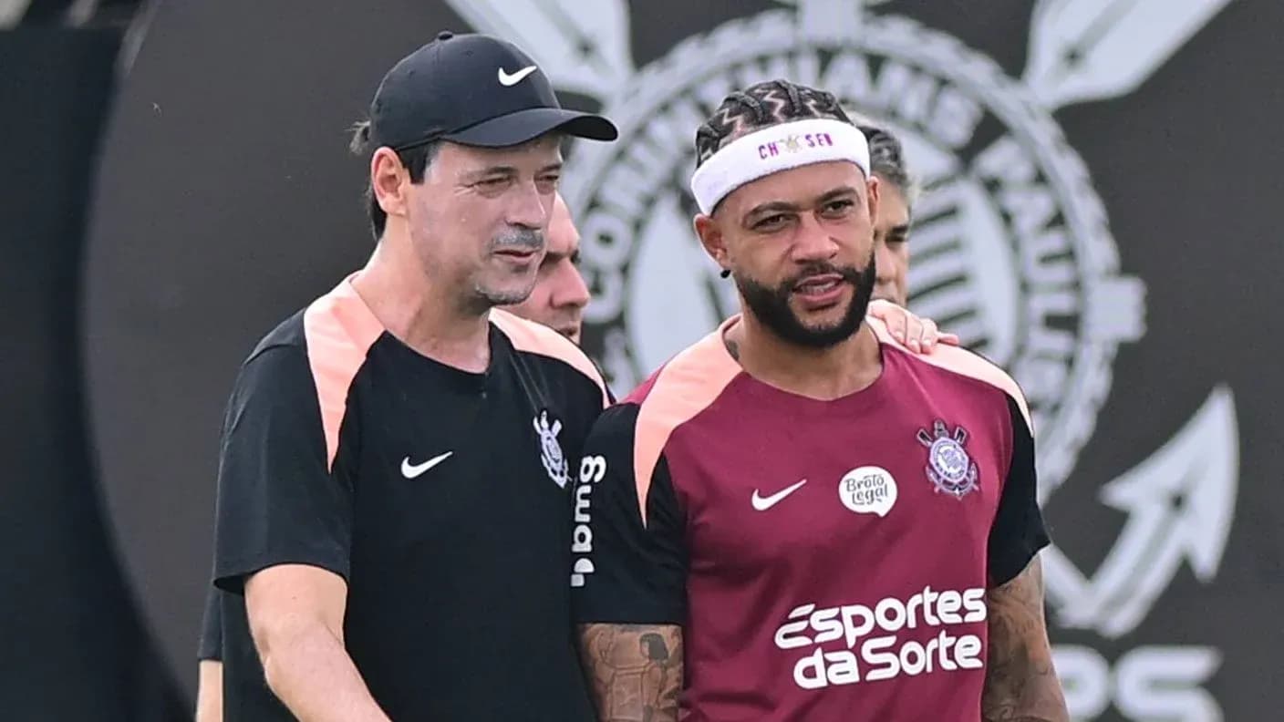 Coach and player talking during training session