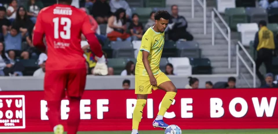 Player preparing to kick the ball during match