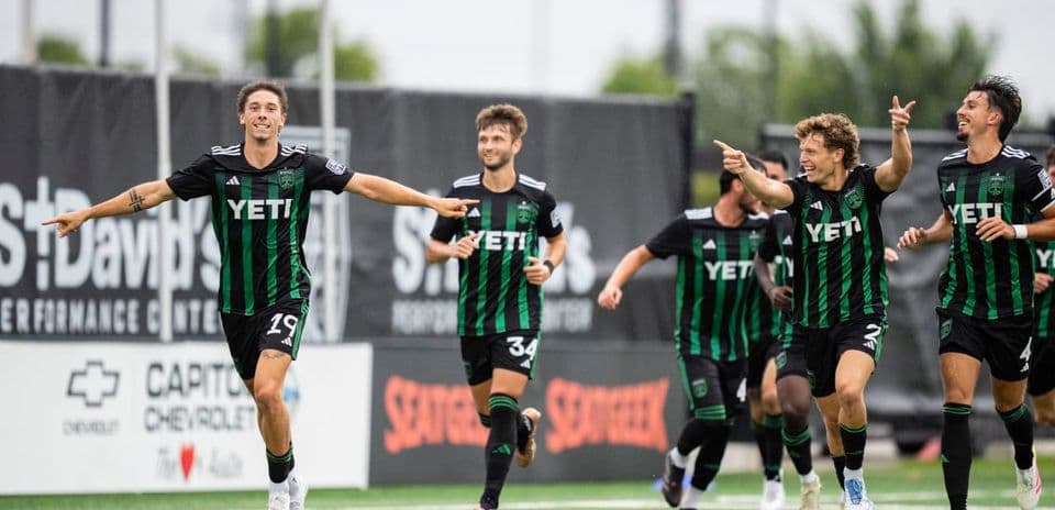 Austin II players celebrating a goal during match
