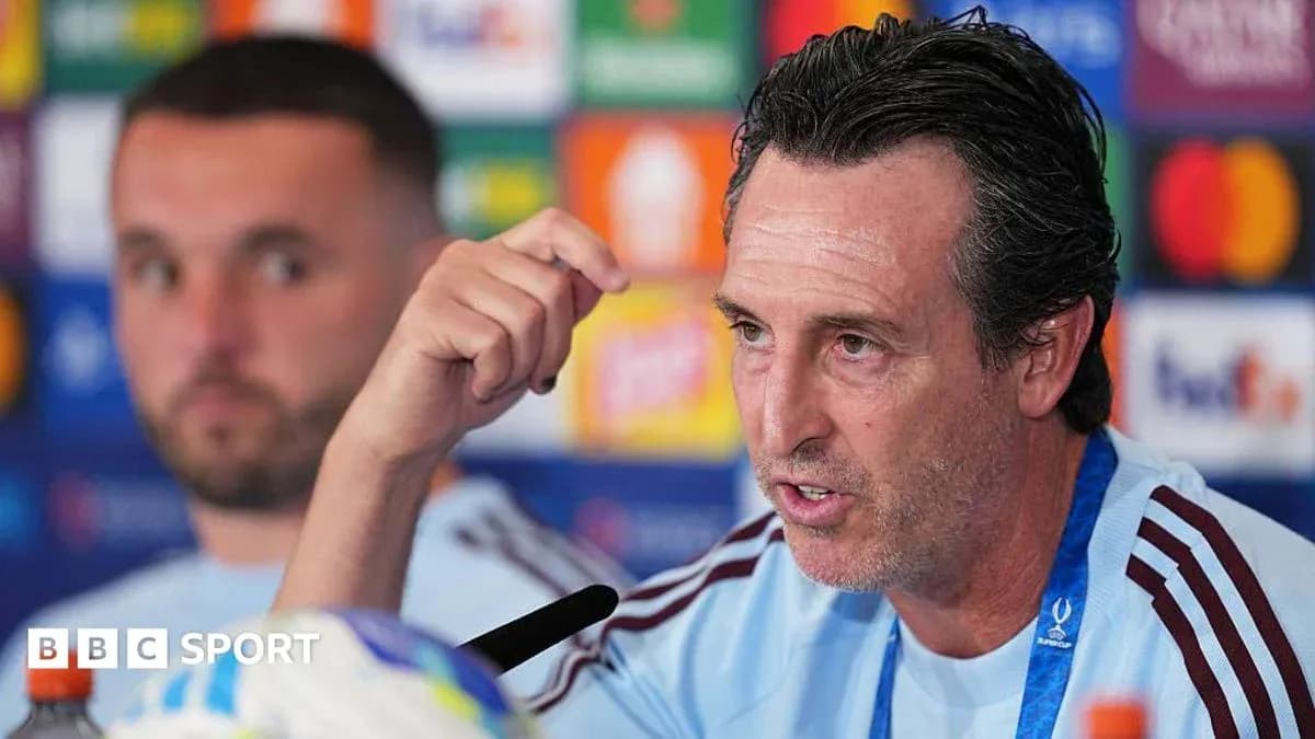 Manager speaking at press conference with teammate