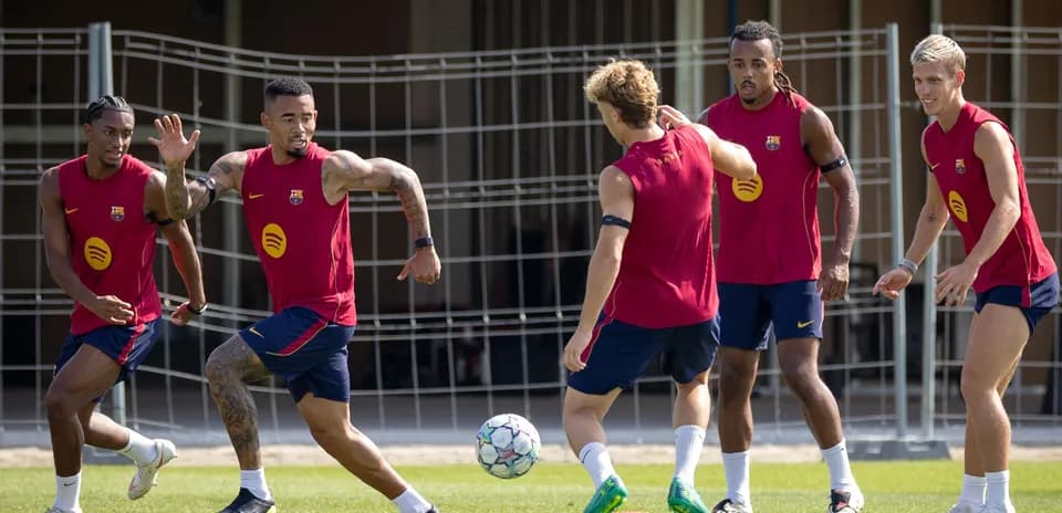 Barcelona players training with a soccer ball
