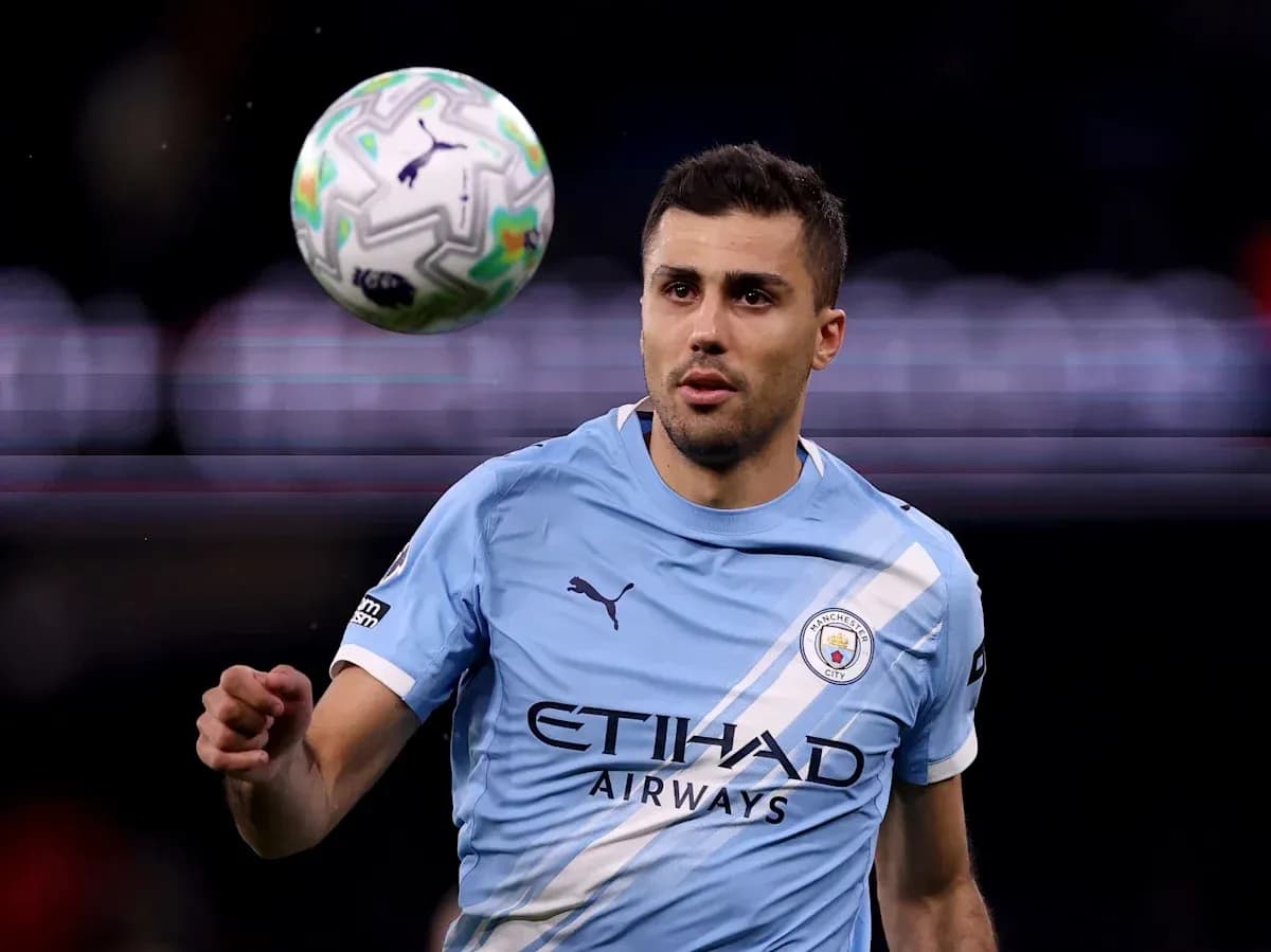 Player in Manchester City kit controlling a ball