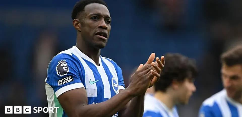Player clapping in Brighton home kit after match