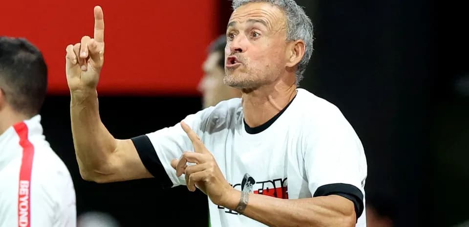 Coach giving instructions from the sidelines during match