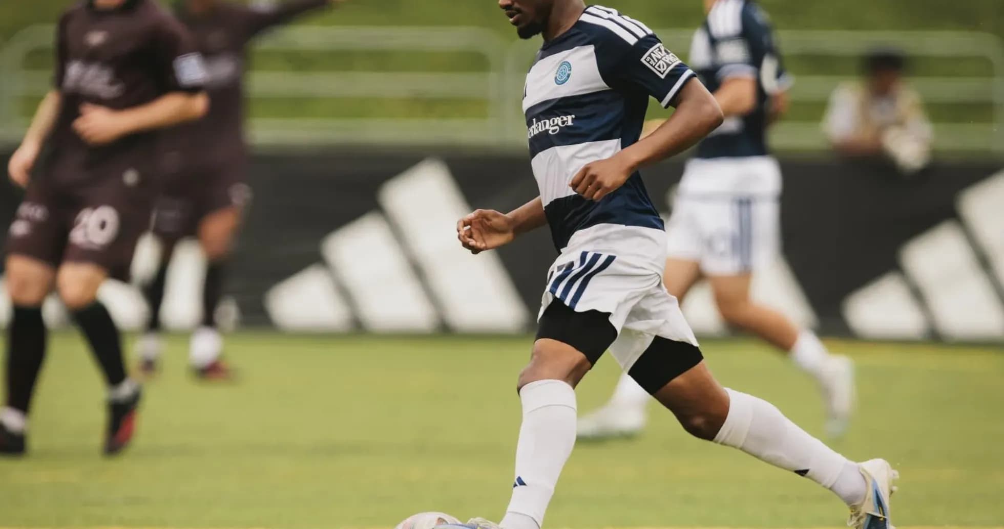 Player dribbling the ball during MLS Next Pro match