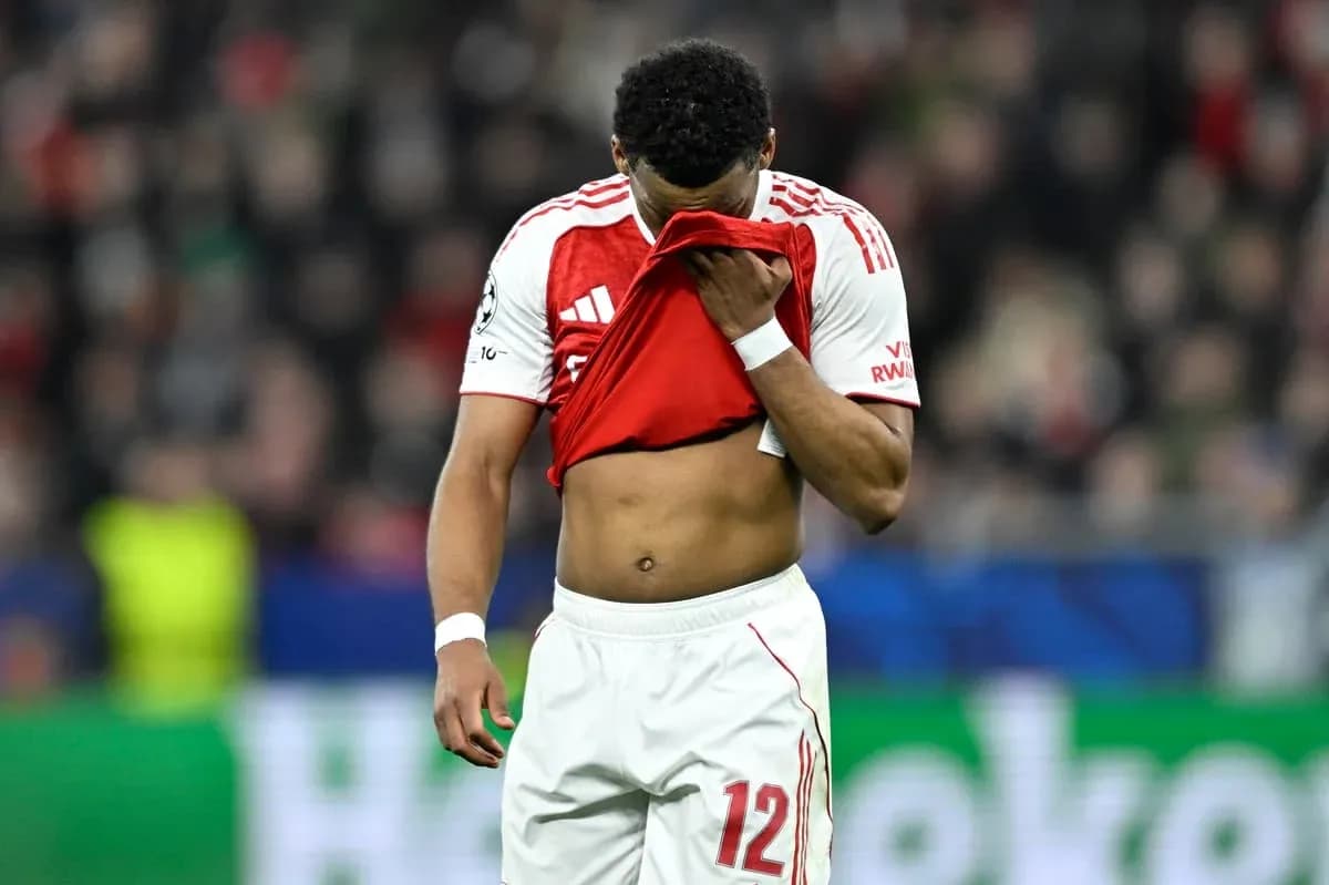 Player holding shirt to face on the pitch