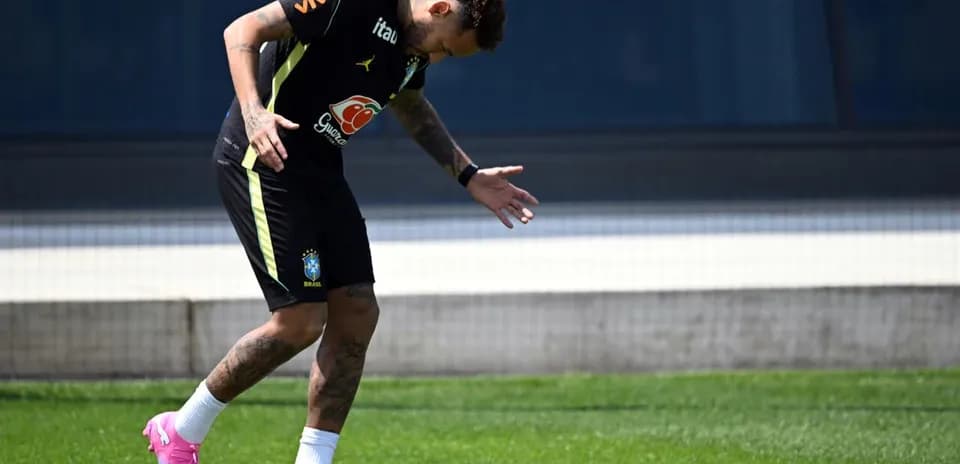 Player training on field in Brazil kit