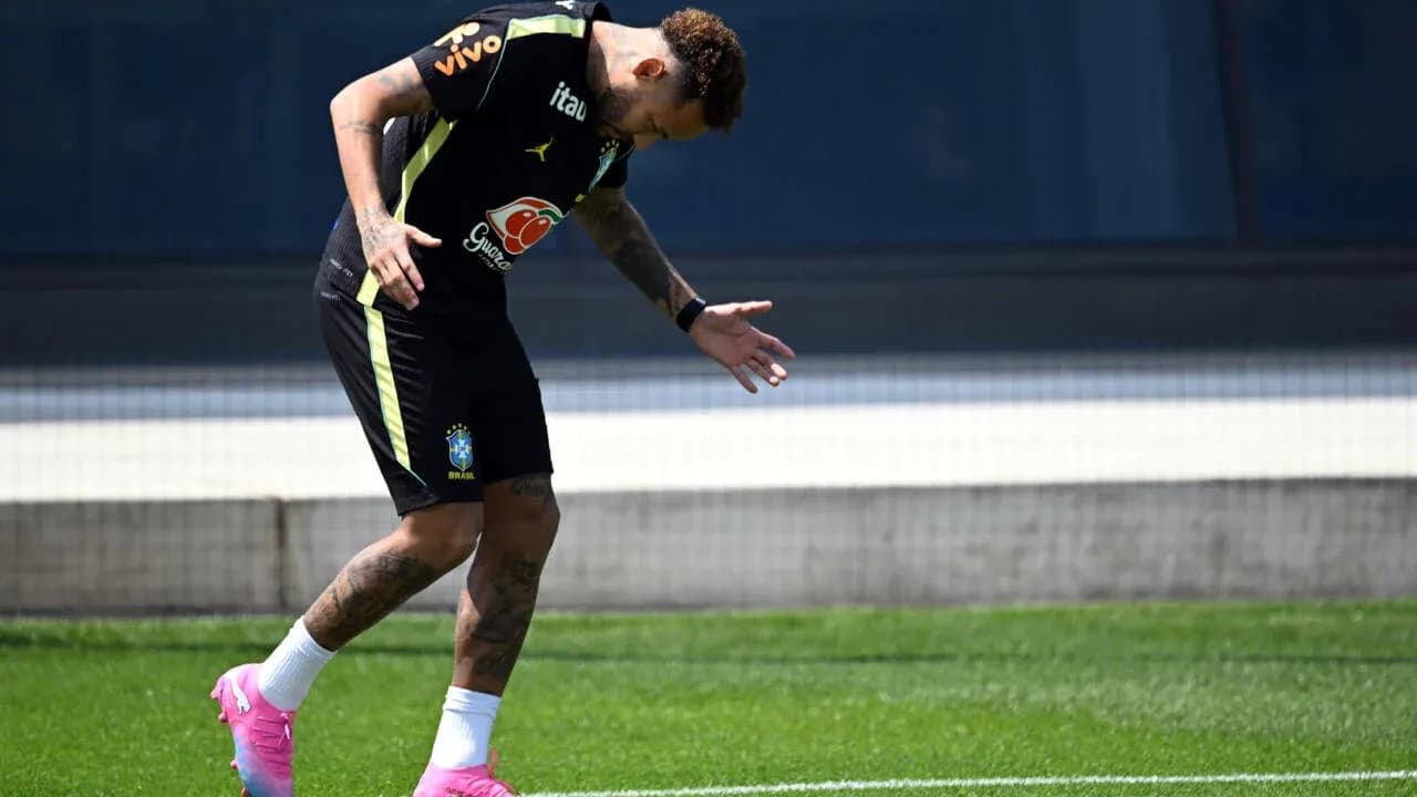 Player training on field in Brazil kit