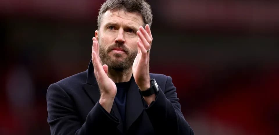 Coach applauding fans during match at stadium