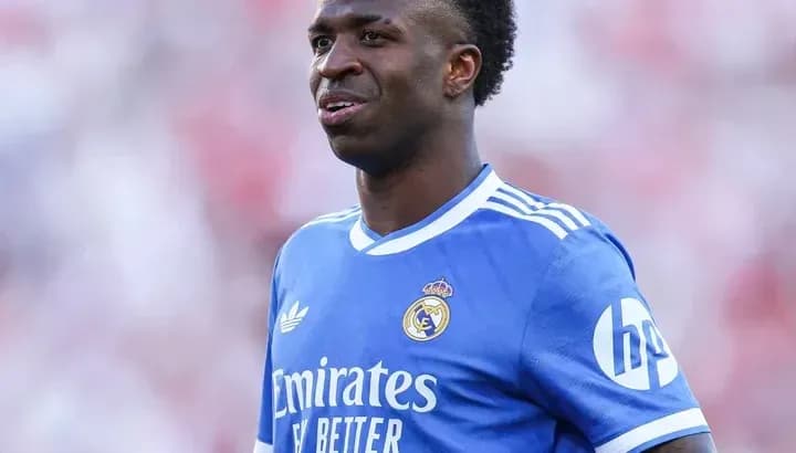 Player wearing blue Real Madrid jersey on field