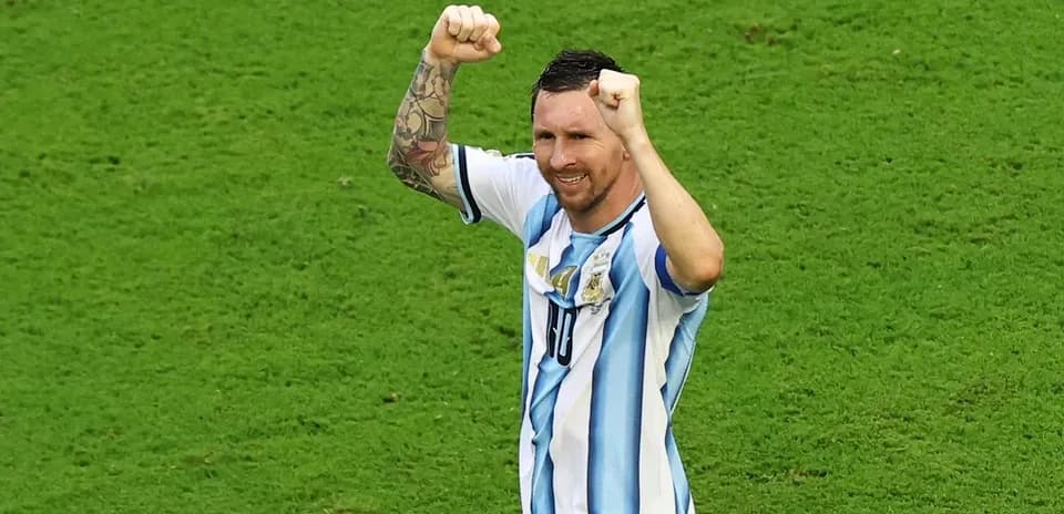Player celebrating with raised fists on the field