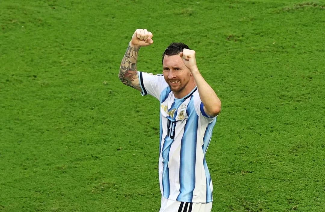 Player celebrating with raised fists on the field