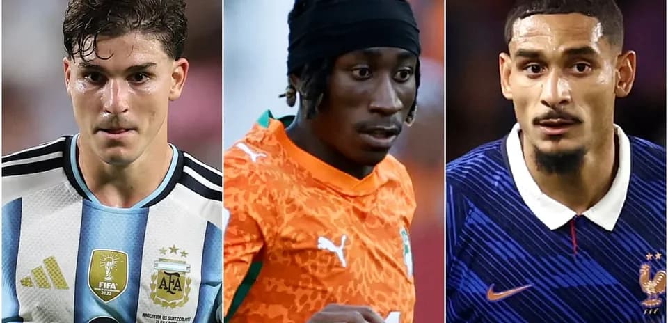 Three football players in national team jerseys