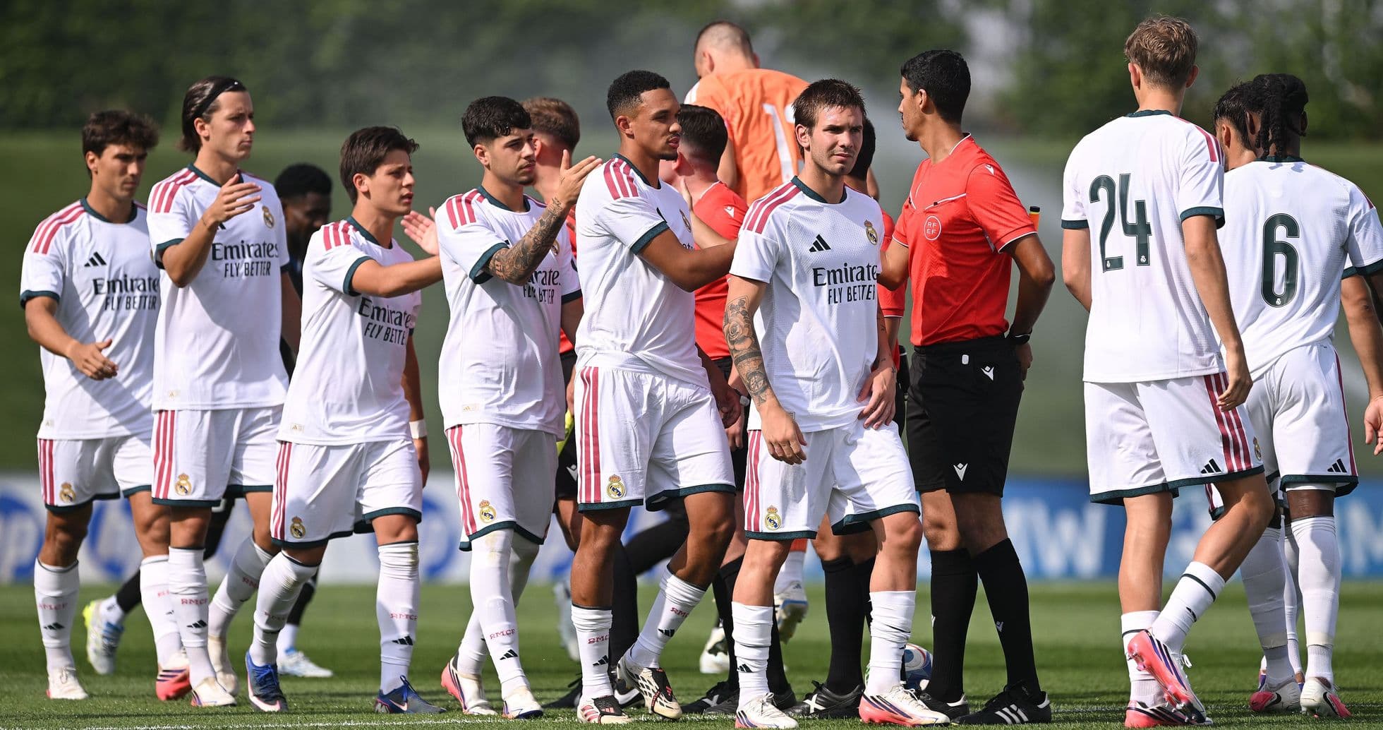 Real Madrid players greeting officials before match