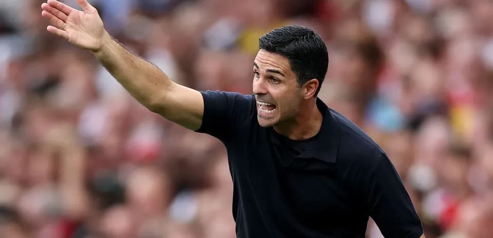 Manager gesturing during a match on the sideline