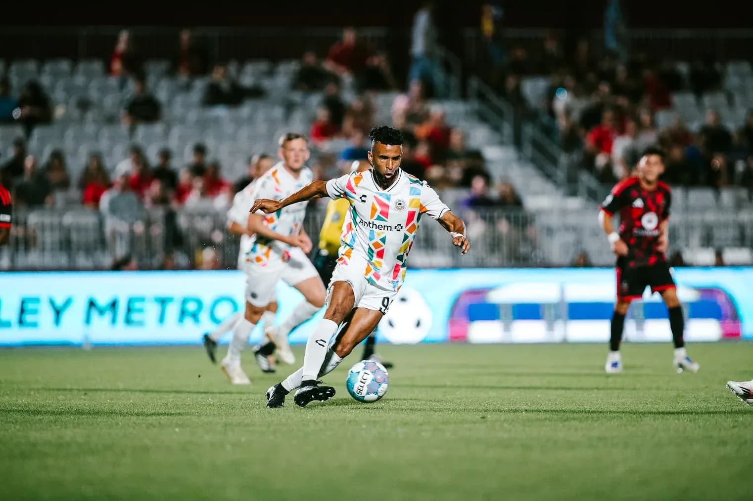 Player dribbling ball during Phoenix Rising match