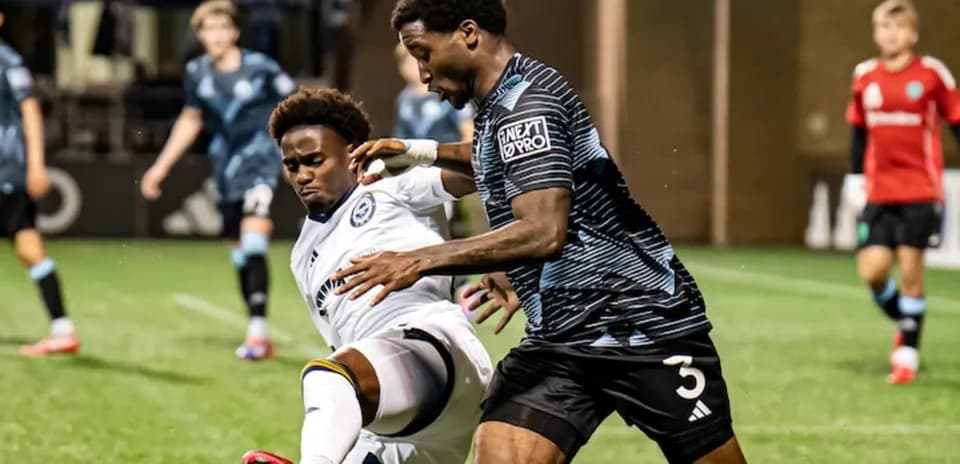 Tacoma Defiance player tackling Ventura County opponent
