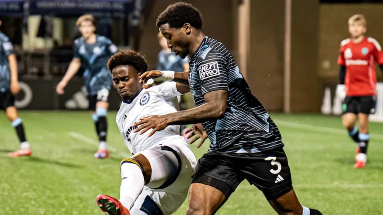 Tacoma Defiance player tackling Ventura County opponent
