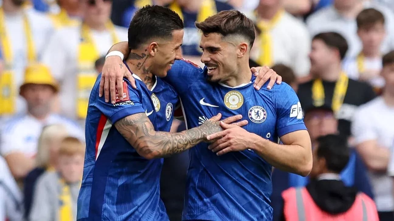 Two Chelsea players celebrating a goal together