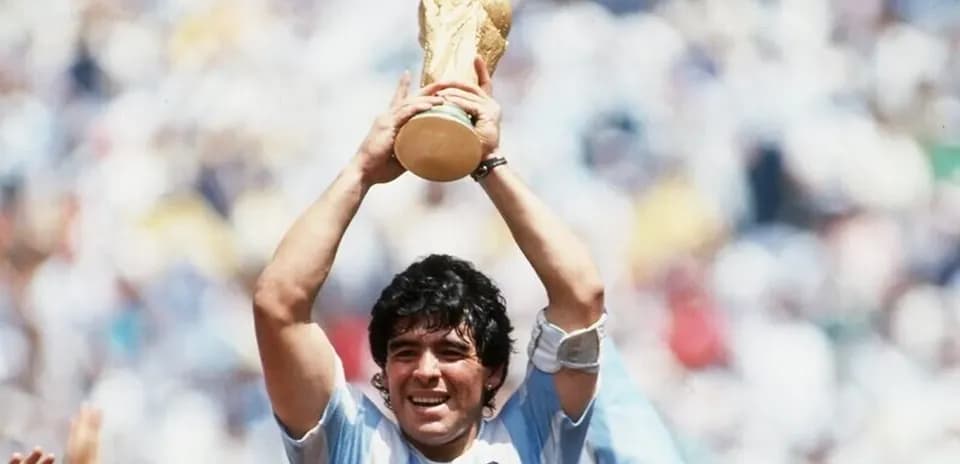 Player holding the World Cup trophy aloft