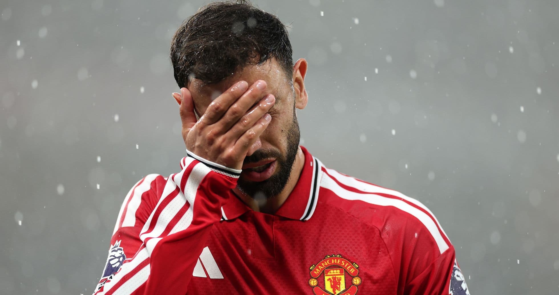 Player covering face with hand during match