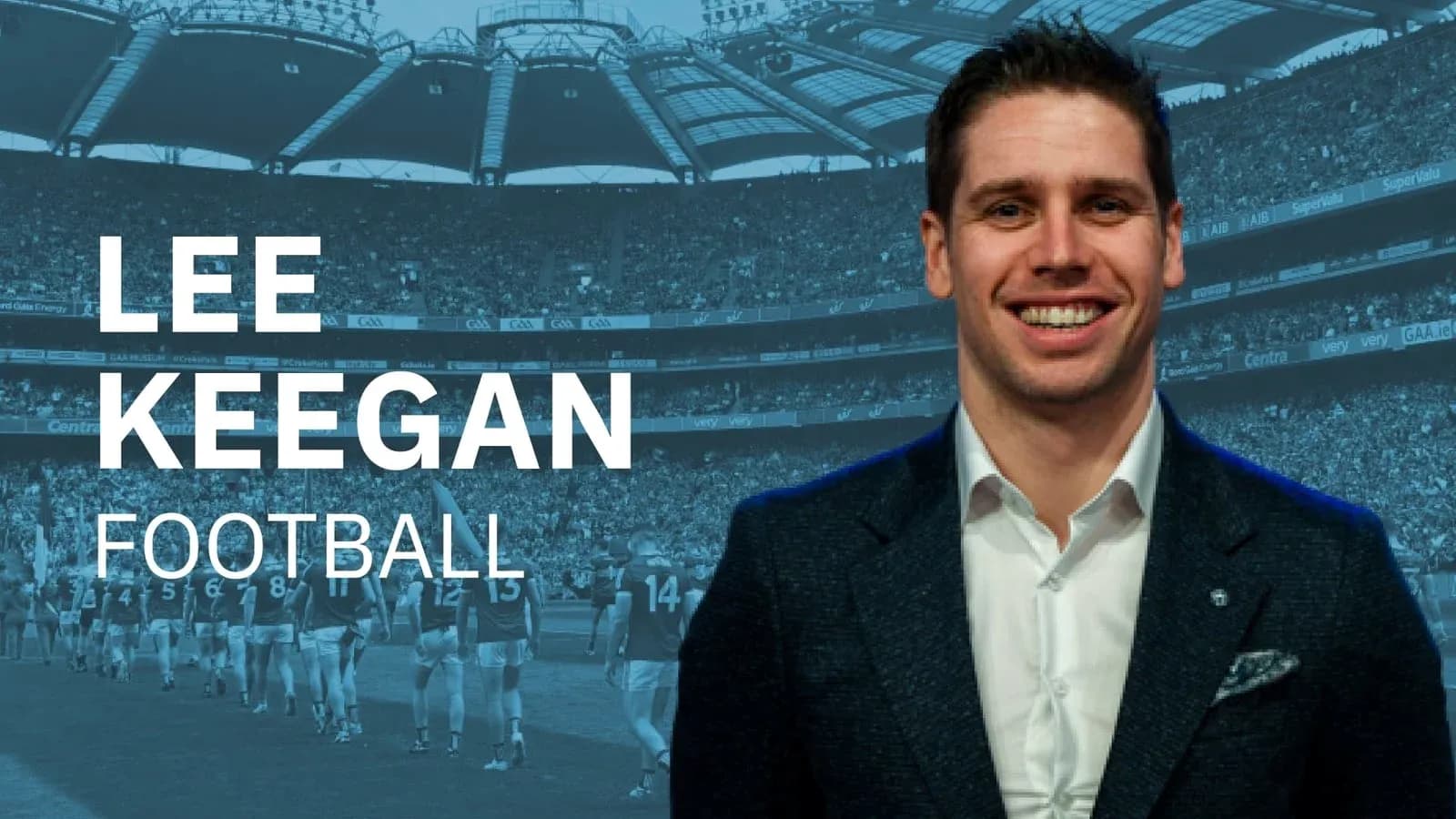 Lee Keegan smiling with football stadium background