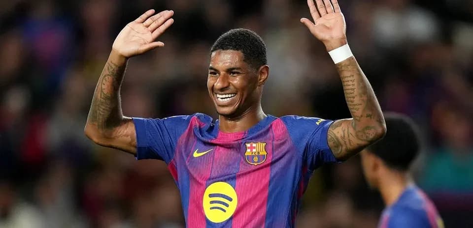 Barcelona player celebrating with raised hands